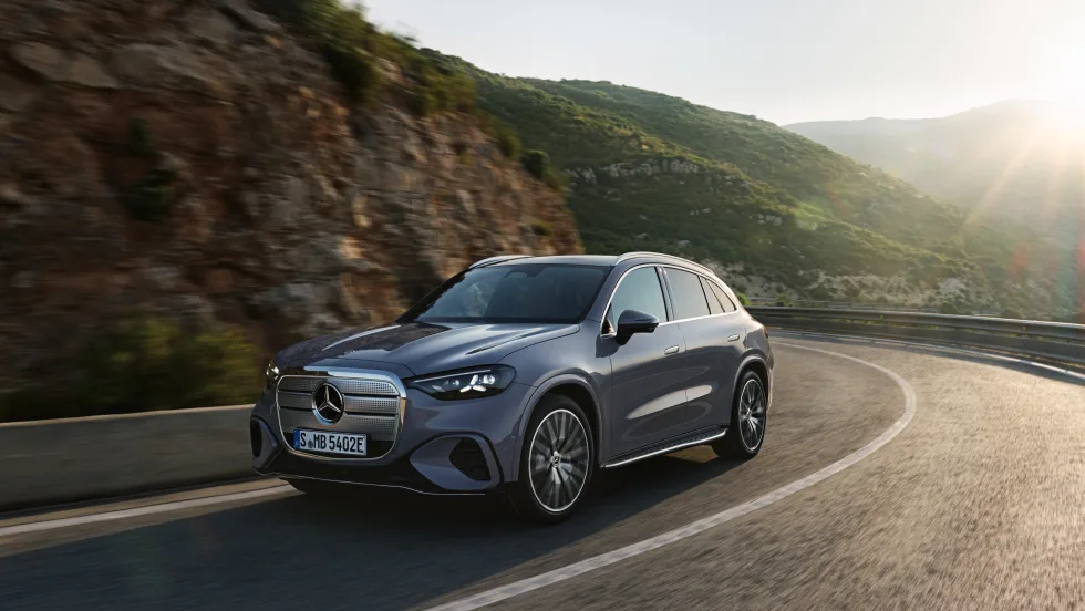 A Mercedes-Benz GLC drives on a road