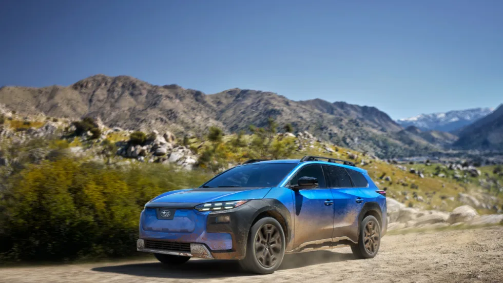 A blue 2026 Subaru Trailseeker sits on a desert landscape. 