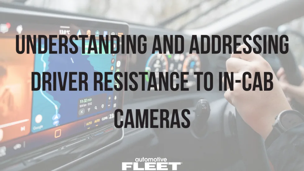 Driver holding steering wheel with dashboard navigation screen visible, overlaid with text about in-cab cameras and driver resistance in fleet safety technology.