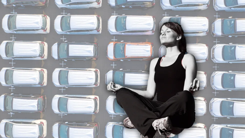 Yoga pose with vehicles in background