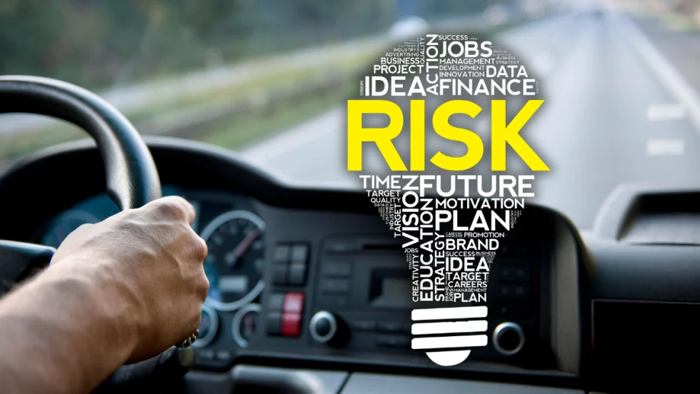 truck driver facing road with risk lightbulb overlaid.