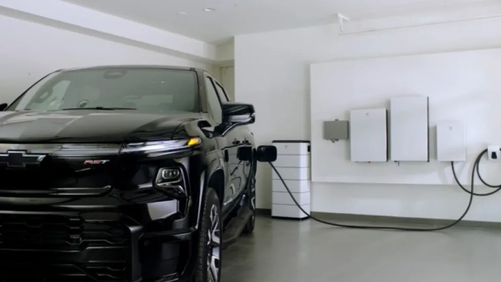 An electric truck from GM plugs into the garage side.