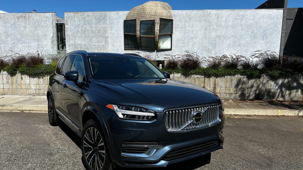 A parked late-model Volvo XC90 midsize three row SUV.