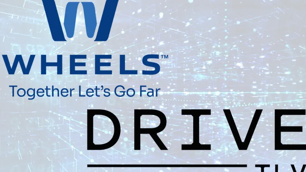 The Wheels and Drive TLV logo is bolded and overlays a blue, futuristic background. 