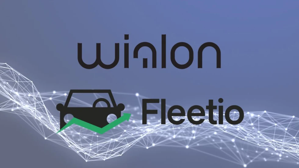 Wialon and Fleetio logos in front of a picture of lines that connect.