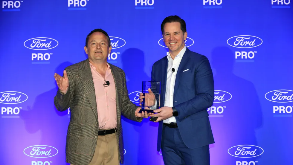 Chris Brown and Matt Atkenson of Ford Pro for Commercial Van of the Year at Work Truck Week