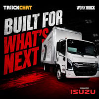 A white next-generation Isuzu medium-duty box truck is featured in a dramatic trade show thumbnail with bold red and white text reading “Built for What’s Next” alongside TruckChat and Work Truck branding.