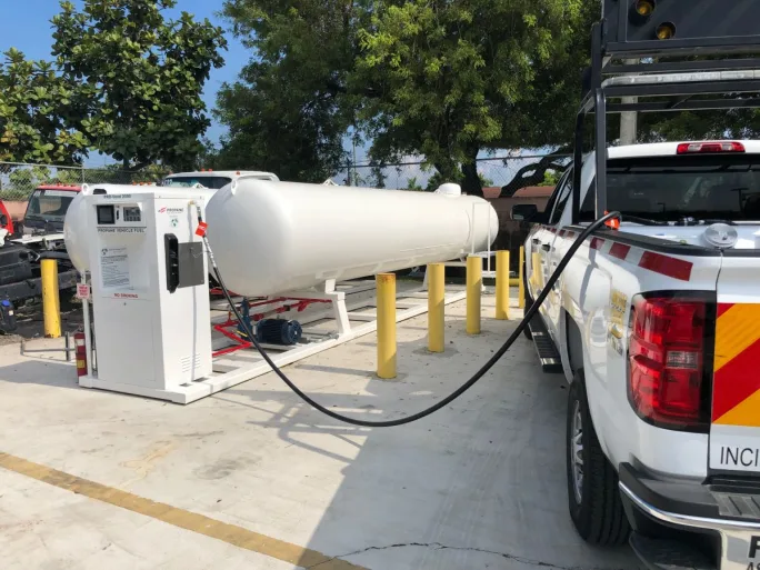 A white pickup being refueled with propane autogas
