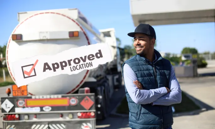 Driver standing near a fuel tanker with an “Approved Location” graphic overlay, representing fuel controls, fraud prevention, and better fueling decisions for fleets.