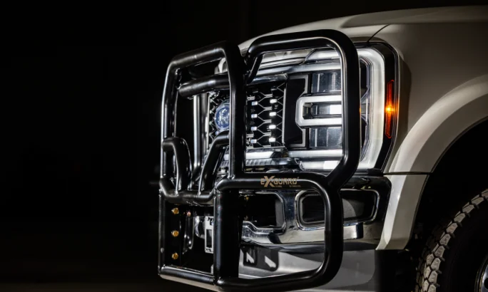 Side view of a black grille guard on a Ford truck.