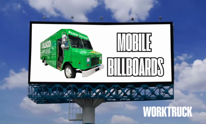 Green walk-in van on a billboard labeled “Mobile Billboards” with WORKTRUCK branding.