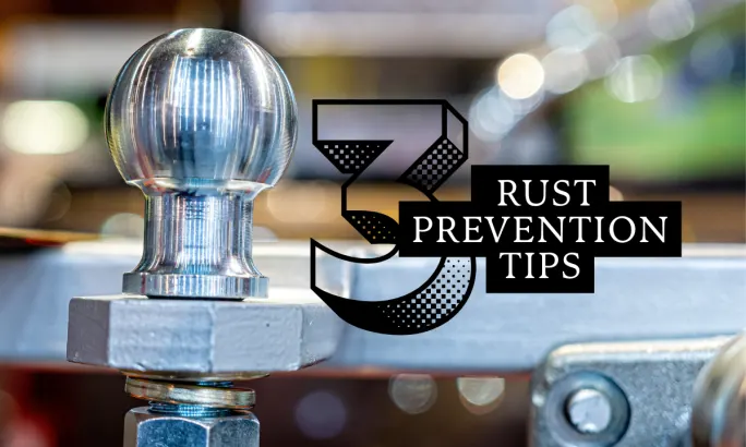 Shiny trailer hitch ball representing rust prevention tips and proper maintenance for work truck fleets.