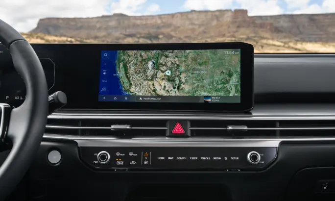 Dashboard of the 2026 Kia Sorento Hybrid showing a wide navigation display and center controls.
