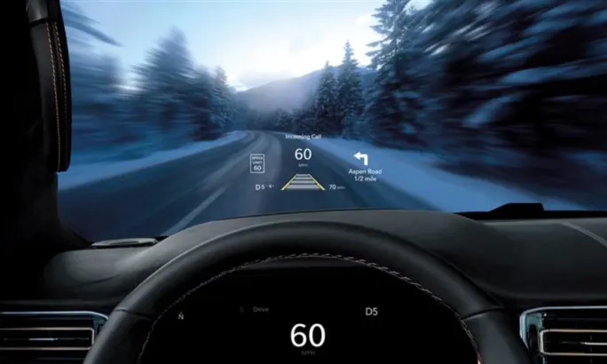 Driver’s view of the 2026 Jeep Grand Wagoneer Head-Up Display showing speed, navigation, and alerts on the windshield.