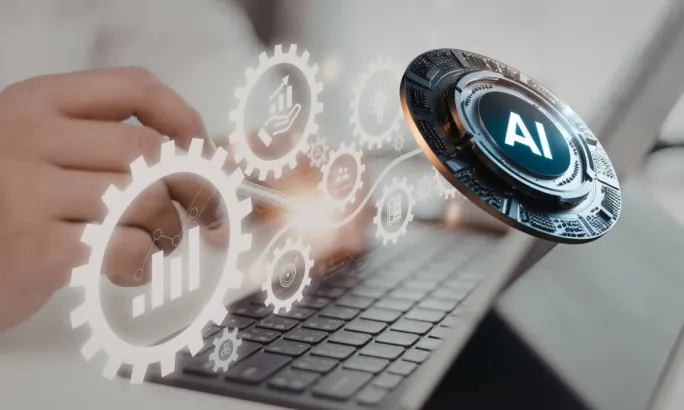 Hands typing on a laptop with digital gears and an AI icon, representing integrated fleet technology, automation, and responsible AI decision-making in 2026.
