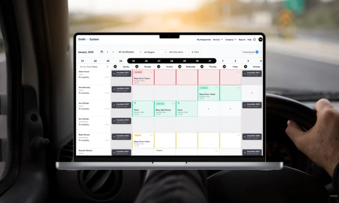 Laptop screen shows Trainer Center’s centralized scheduler with trainer availability and Smith5Keys class sessions organized across locations.