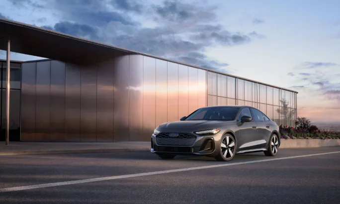 Exterior view of a 2026 Audi A5 parked outside a modern building.
