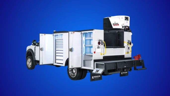 Reading Truck service body with open side compartments and rear welder/generator unit mounted on a work truck, showing organized storage and equipment for mobile jobsite operations.