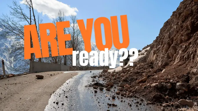 Rockslide blocking a mountain road highlighting fleet readiness and need for real-time driver reporting during disasters and disrupted routes
