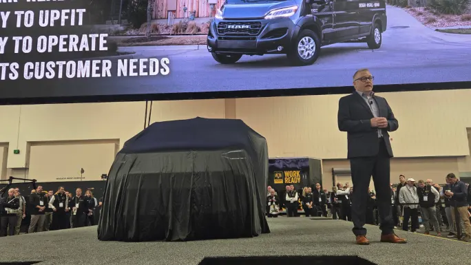 Ram unveils the next-generation ProMaster City commercial van on stage at Work Truck Week 2026 in Indianapolis as attendees gather around the reveal.
