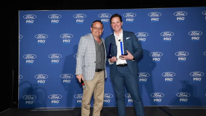 Award winners pose with trophies at the Work Truck Week commercial vehicle awards ceremony recognizing fleet innovation and work truck technology.
