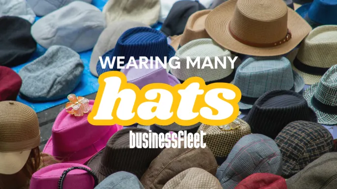 Collection of different hats with text “Wearing Many Hats,” representing the many roles small fleet managers juggle daily.