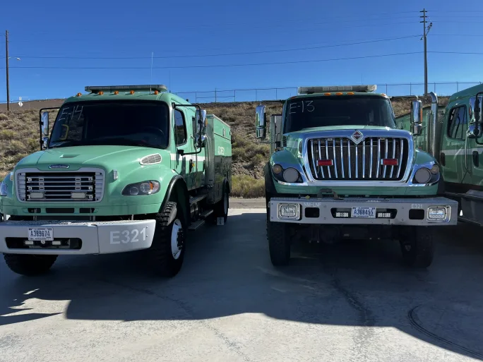 Collection of fleet disaster response scenes including fire trucks, staging camps, equipment transport, and field operations showing real-world readiness in action