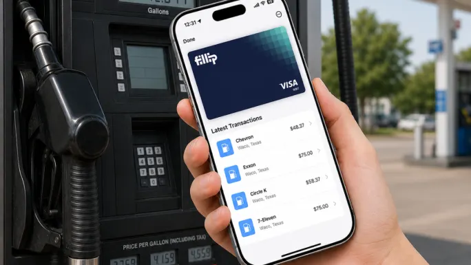 Hand holding a smartphone displaying the Fillip Fleet digital fuel card app beside a fuel pump at a gas station.