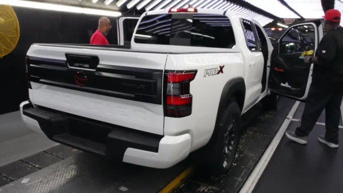 A white Nissan Frontier PRO-X pickup undergoes final inspection on the production line at Nissan's Canton, Mississippi, assembly plant.