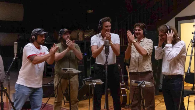 The Red Clay Strays gather around studio microphones while recording Chevrolet's updated