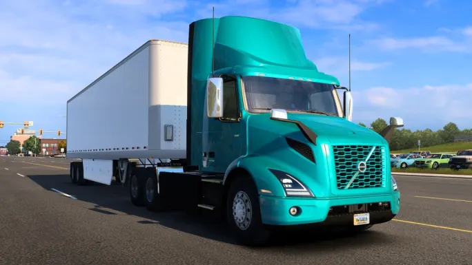 Teal Volvo VNR Electric tractor hauling a white box trailer in American Truck Simulator.