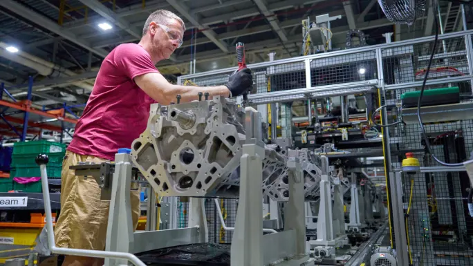 Worker assembles a sixth-generation GM V-8 engine at Flint Engine Operations.