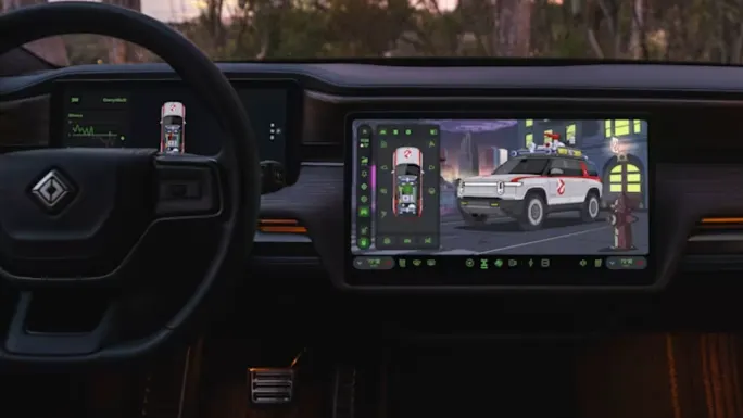 Interior of a Rivian vehicle showing its touchscreen display with a Ghostbusters-themed Ecto-R1 graphic, vehicle controls, and Halloween-inspired interface.