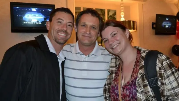 Charlie Mahoney (left), Bob Adamsky (center), and Lauren Fletcher (right) smile together at a fleet industry event, reflecting the friendships and professional connections built over years in the industry.
