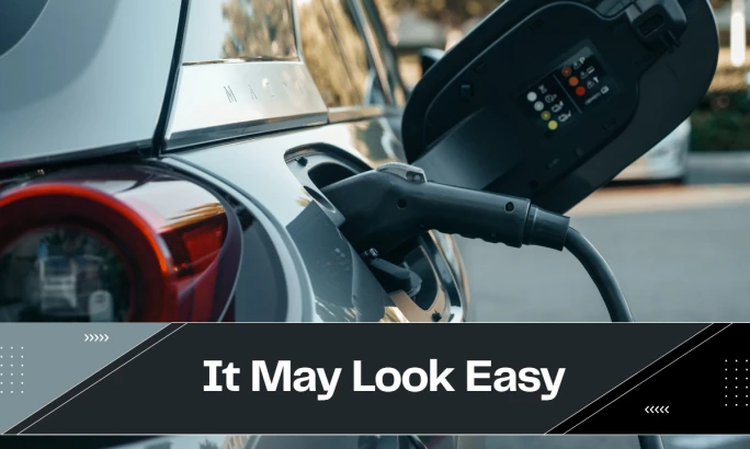 A close-up photo of the right rear backside of an EV being charged.