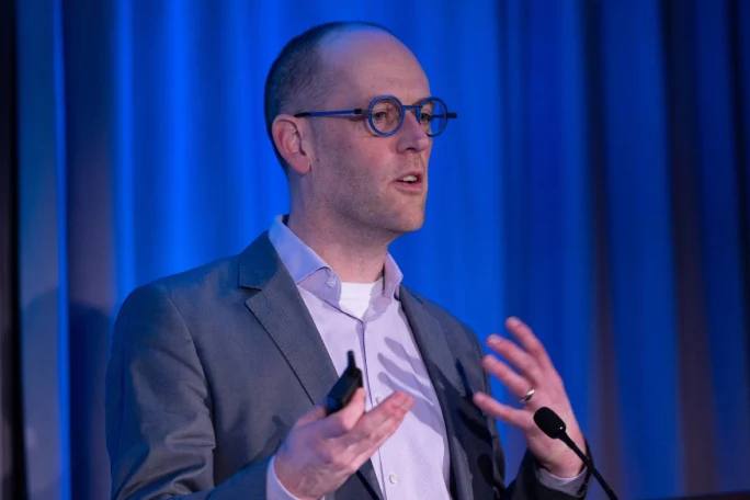 Keynote speaker on stage.