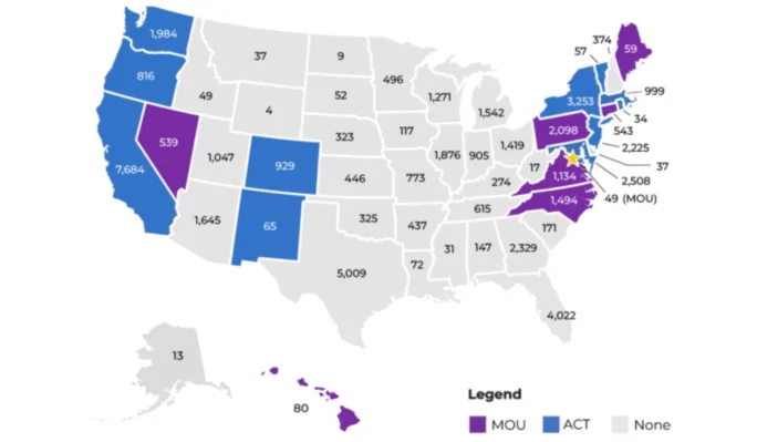 A map of the United States, color-coded to represent the total number of zero-emission trucks deployed in each state.