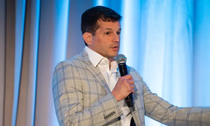 Scott Levy makes a point on stage.