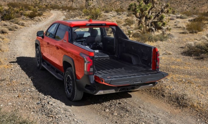 The 2026 Chevy Silverado Trail Boss EV on a road with the