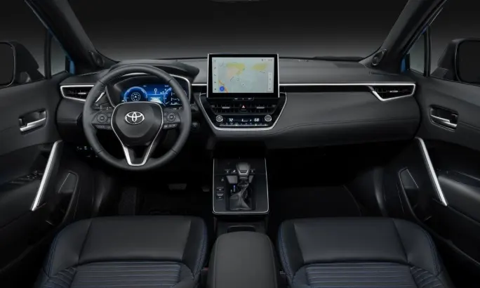 The interior dash and console of the new 2026 Toyota Corolla Cross.