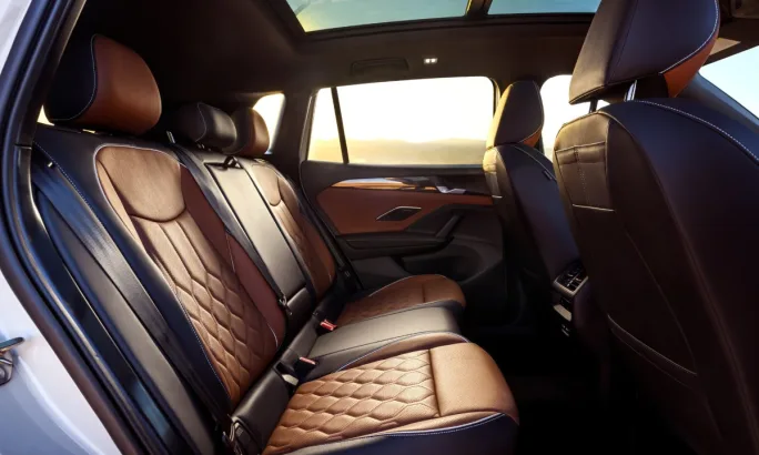 A 2025 Volkswagen Tiguan interior view of the back seat.