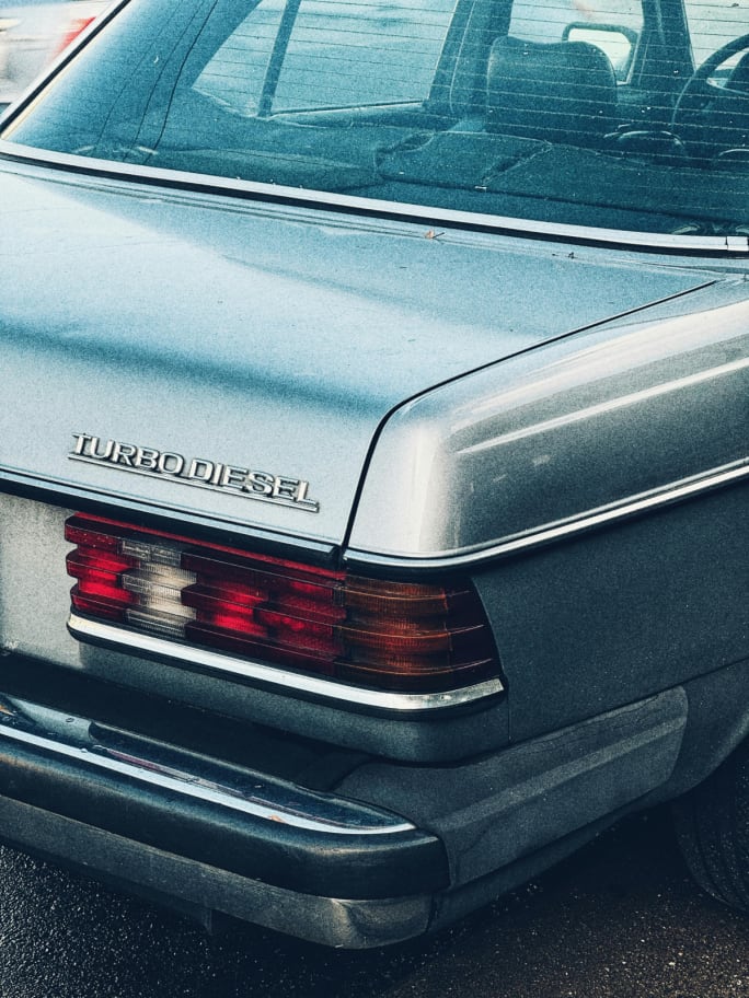The back side of a gray 1970s-era Mercedes-Benz Turbo Diesel.