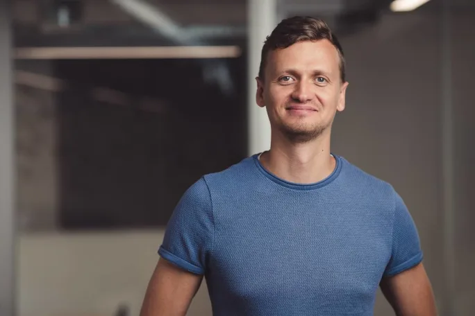 Photo of article contributor in blue stretch T-shirt.