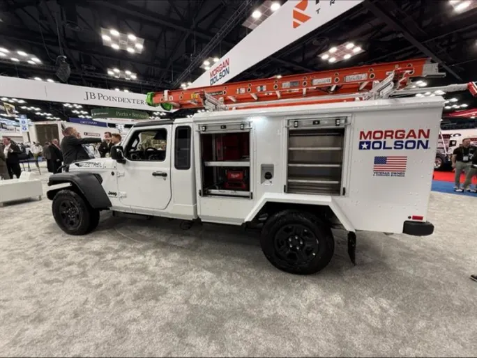 Morgan Olson Kestrel work truck on Jeep Gladiator platform displayed at NTEA Work Truck Week with service body, ladder rack, and tool compartments designed for off-road fleet applications.