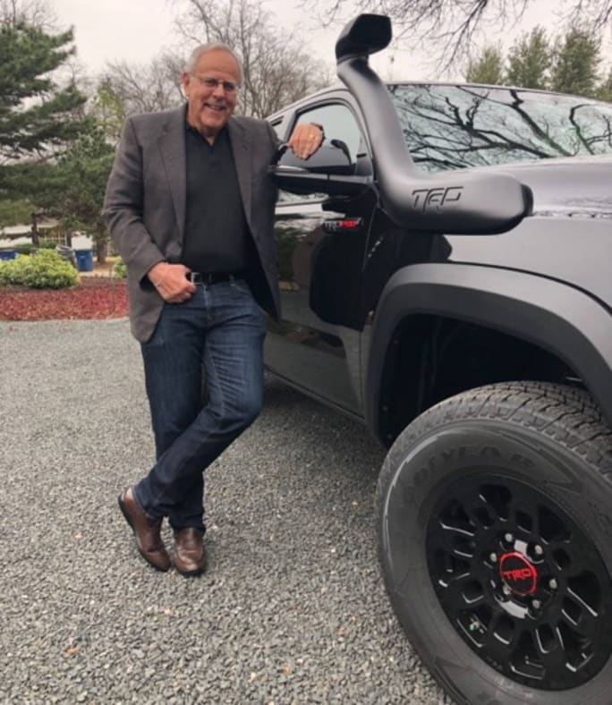 Jim Press with his black Toyota pickup truck.