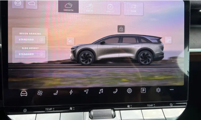 Dashboard display screen image of the Lucid Gravity surrounded by touchscreen control options.