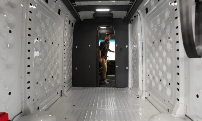 Full view of the back cargo space of a Rivian commercial van.