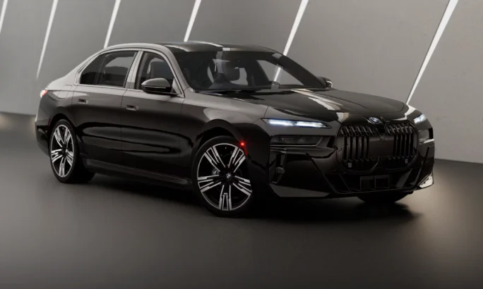 A black 2025 BMW i7 in a gray showroom.