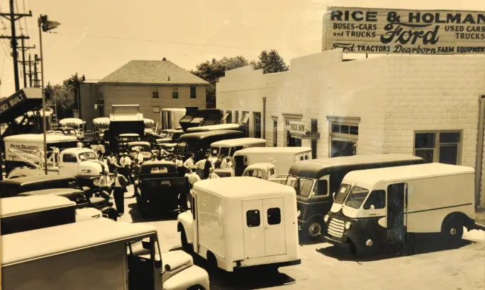 A black and white photo of Rice & Holman is shown.