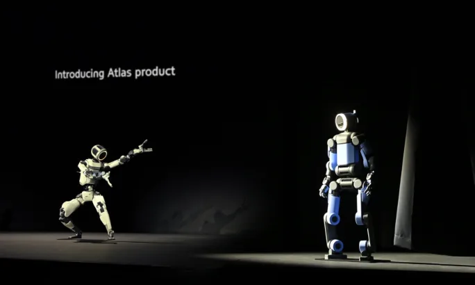 Hyundai presentation showing humanoid robots during a product demonstration highlighting the company’s investment in robotics and future mobility technologies.